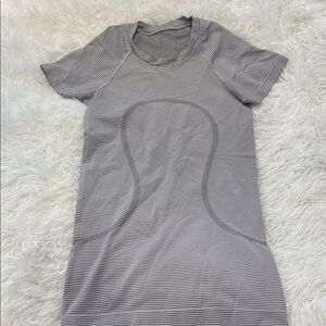 Lululemon Swiftly Tech short sleeve shirt. Size 0. No stains or signs of wear.